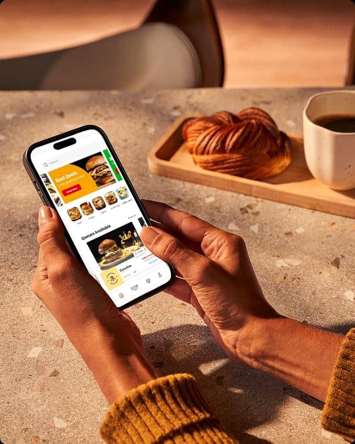 Food ordering app open at a cafe table