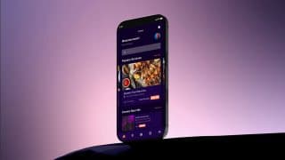 Media app on a phone against a purple backdrop