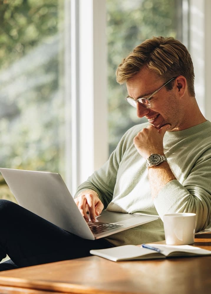 Founder designing an app on a laptop